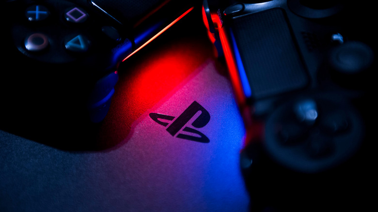 PlayStation Logo next to controllers