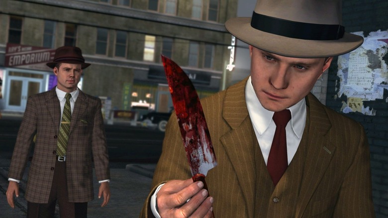 Cole Phelps holding a bloody knife