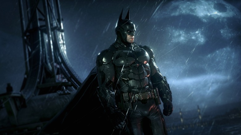 Batman stands in the rain