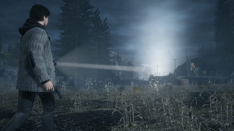 alan wake shining flashlight into field