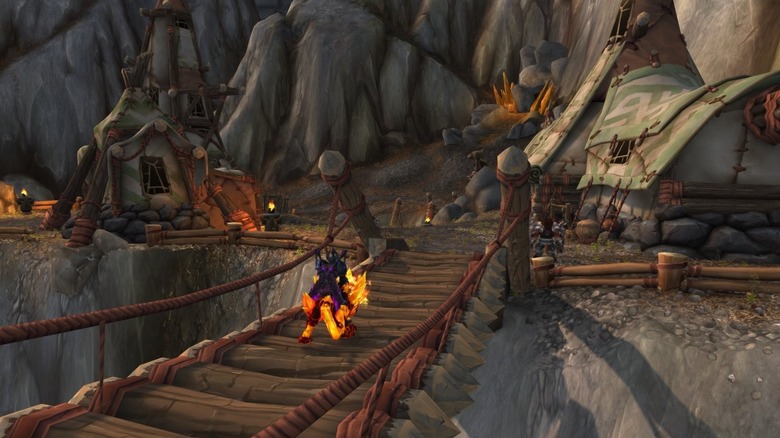 Player crossing rope bridge