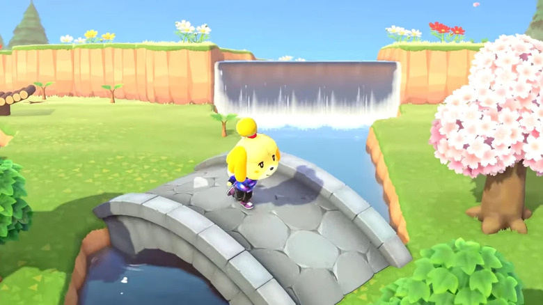 Isabelle walking across a stone bridge