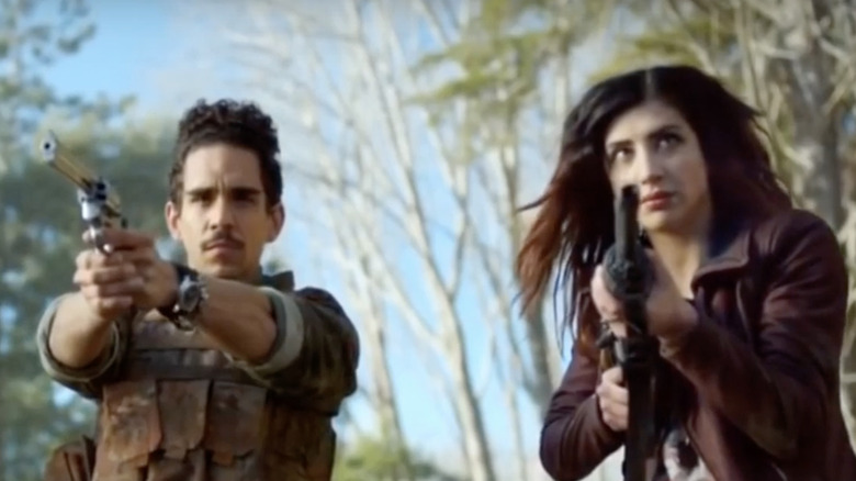 Ray Santiago and Dana DeLorenzo posing in Ash vs Evil Dead