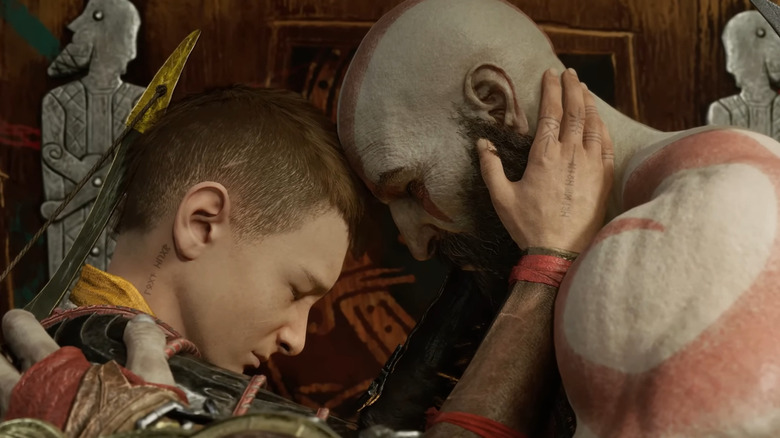 Kratos and Atreus embracing each other