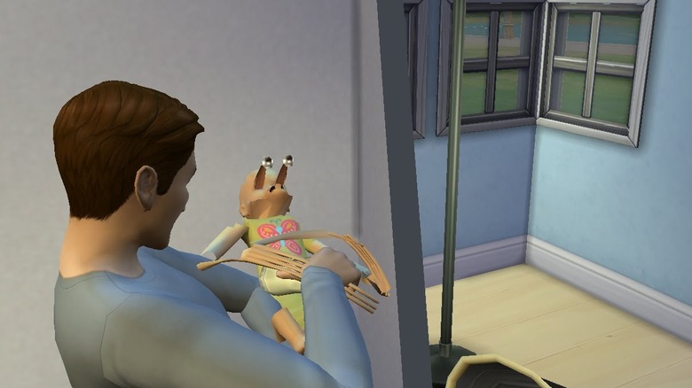 A man holds a malformed video game baby