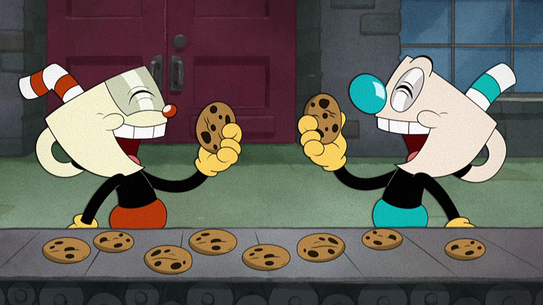 Cuphead and Mugman eating cookies