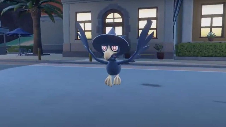 Murkrow in front of a building