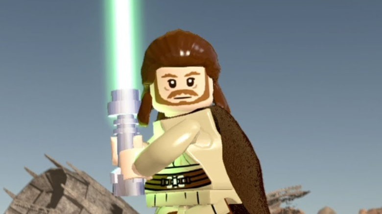 Lego Qui-Gon Jinn ready to fight with his lightsaber. 