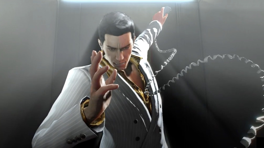 Yakuza's Kiryu holding phone