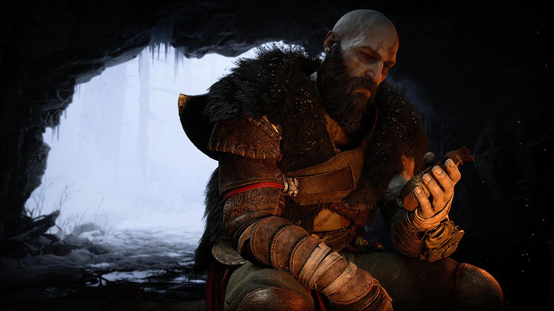 Kratos sitting by the fire