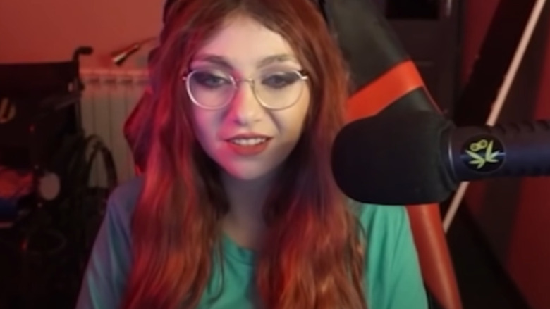 Justaminx with glasses and red hair