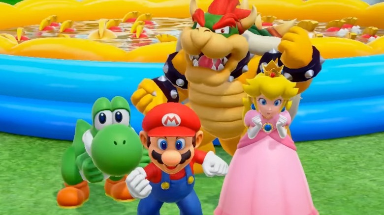 Yoshi, Mario, Bowser, and Peach celebrating