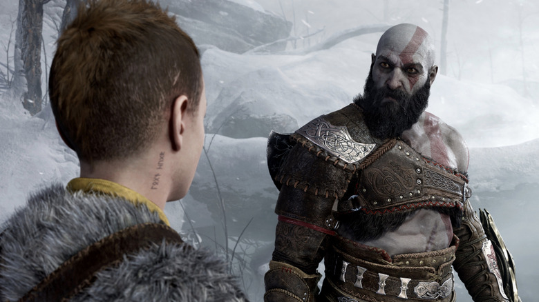 Kratos looks judgingly at Atreus