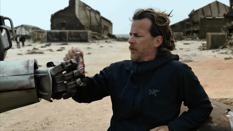 Jonathan Nolan receiving a Nuka-cola