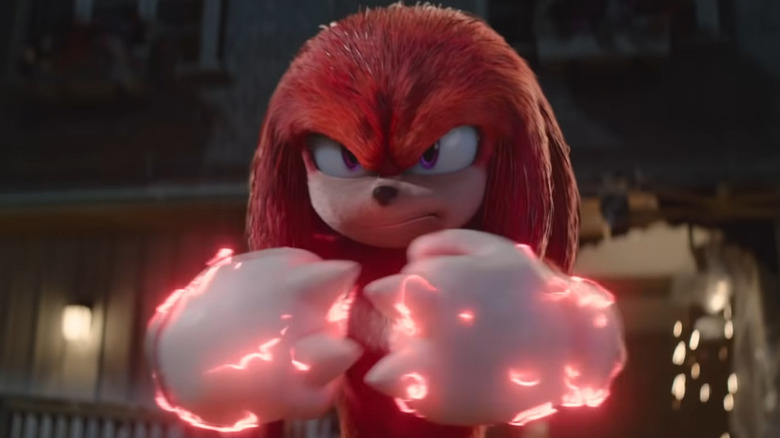 Knuckles pressing fists together