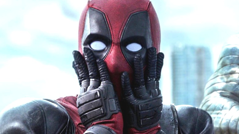 Deadpool with hands on his face