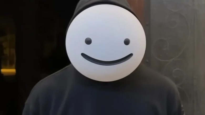 Dream wearing white smiley face mask