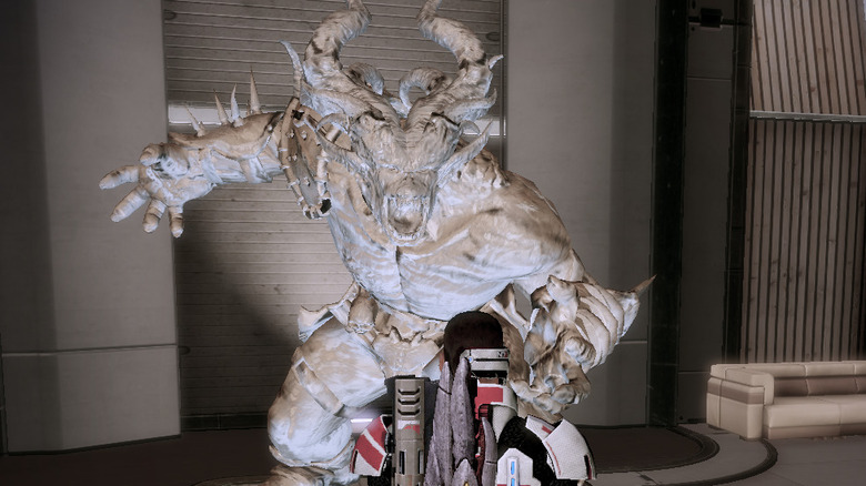 Shepard approaches an ogre statue