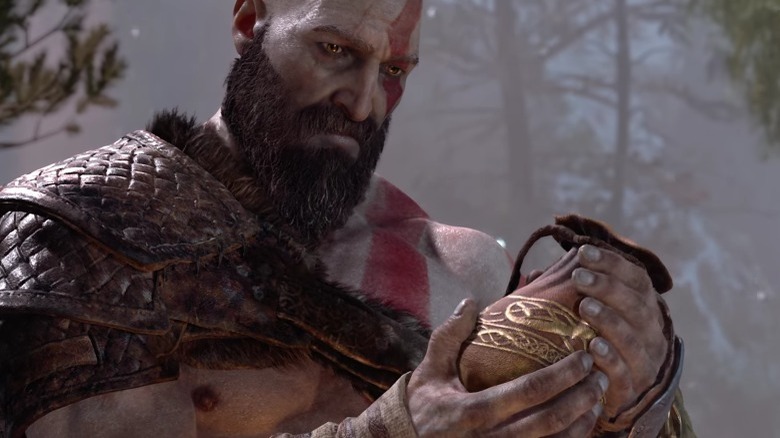 Kratos holding Faye's ashes