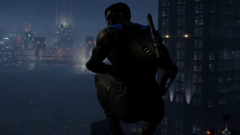 Nightwing squatting on rooftop