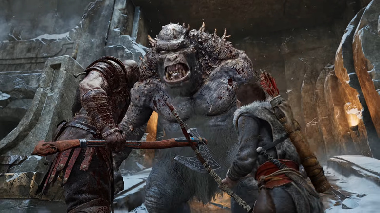 Kratos and son fighting troll