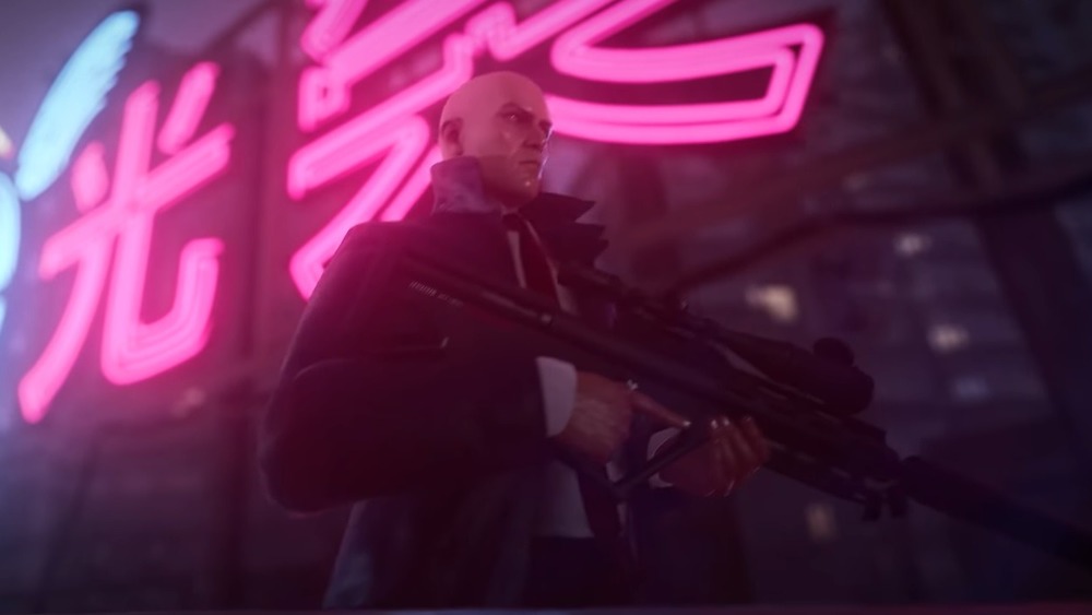 Agent 47 holding a gun in Hitman 3