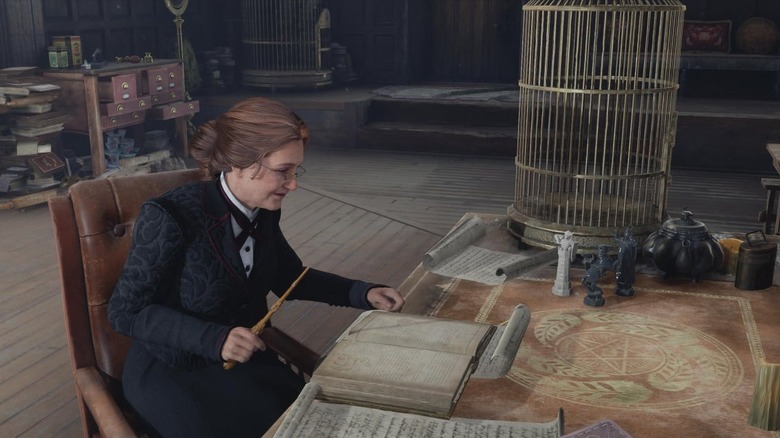 Professor Weasley reading at her desk