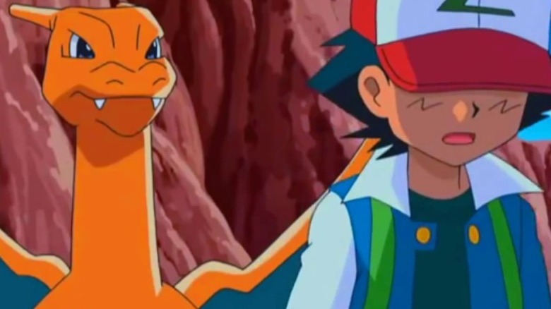 Charizard looks at sad Ash