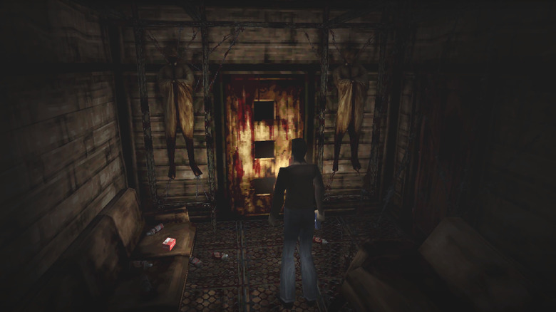 Silent Hill's Harry Mason before a gruesome door