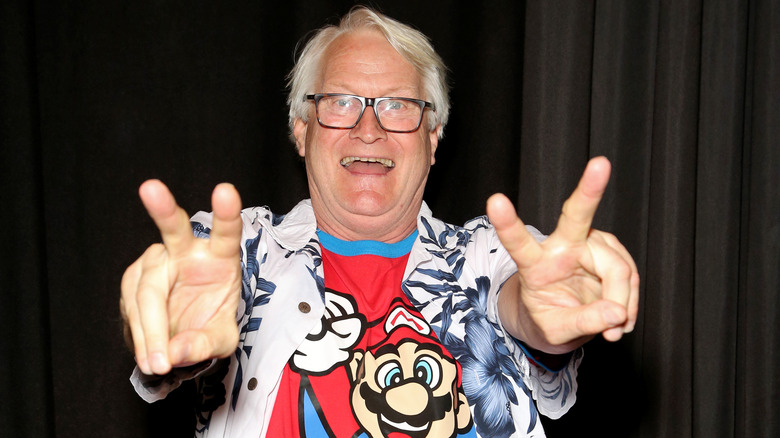 Charles Martinet flashes peace signs at a 2019 convention