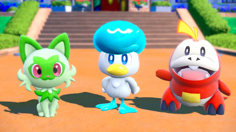 Pokémon Scarlet and Violet starters standing together