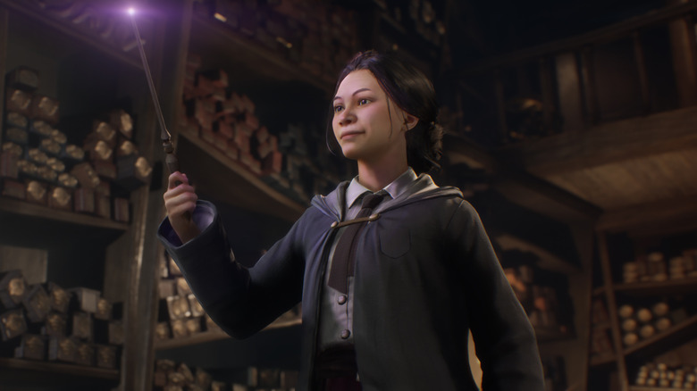 Witch girl waving magic wand in Hogwarts Legacy