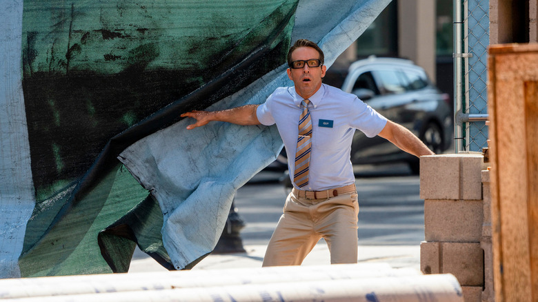 Ryan Reynolds as Guy wearing glasses in Free Guy