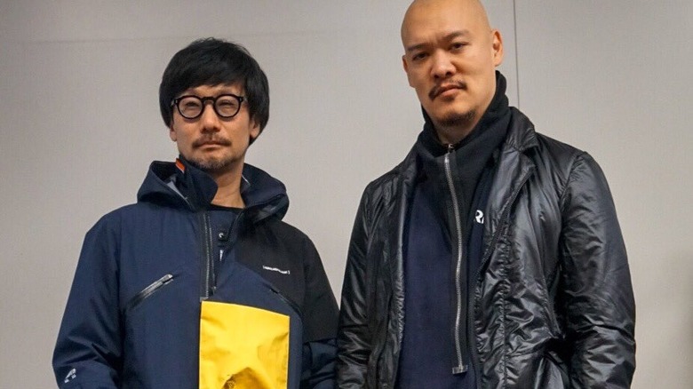 Kojima and model posing with jacket