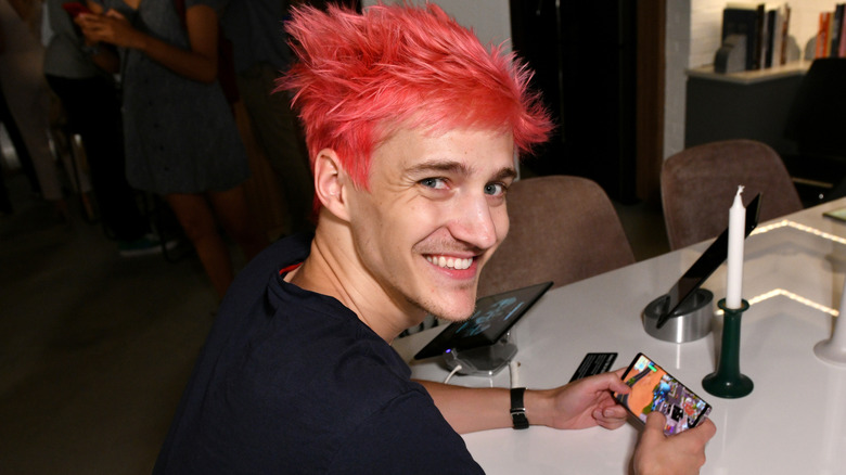 Ninja playing a game on his phone