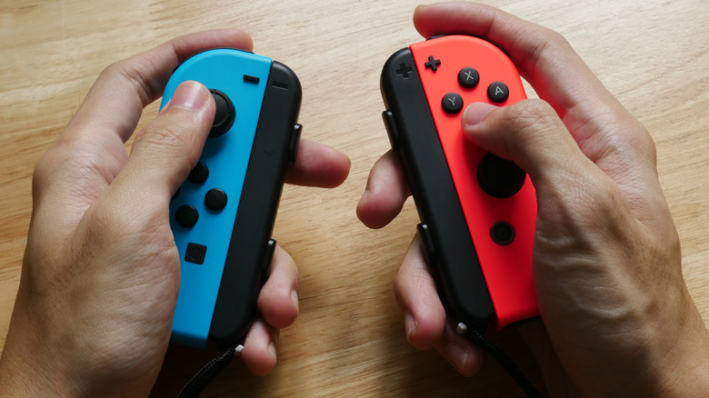 Hands holding Joy Cons