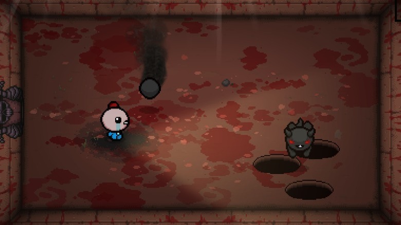 Isaac fighting enemy in the basement