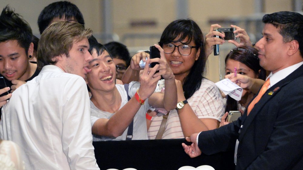 PewDiePie posing with fans at the Social Star Awards in Singapore
