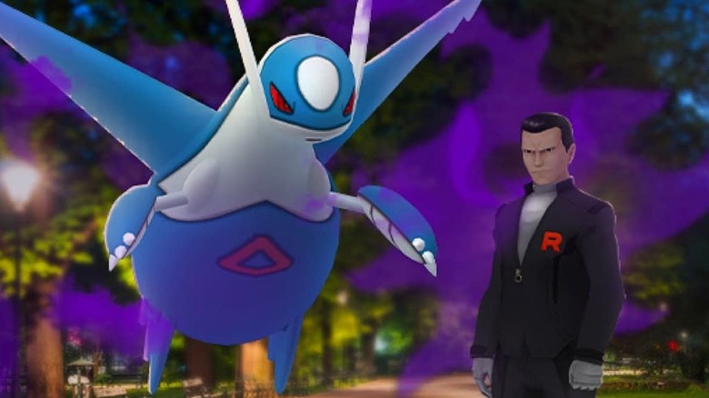 Giovanni posing with Dark Latios