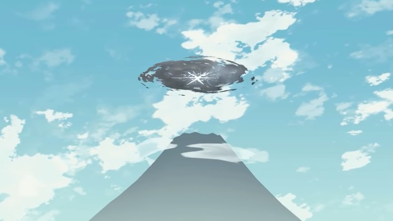 A dark mountain in a blue sky with a white and black star shaped rift above it