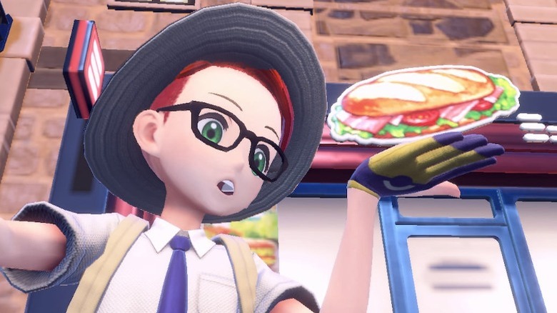 Trainer pretending to hold a sandwich
