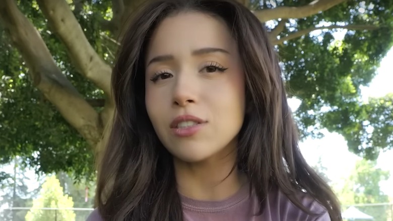 Pokimane sitting in park