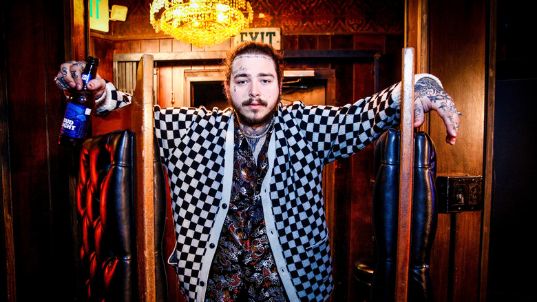 Post Malone posing with a Bud Light