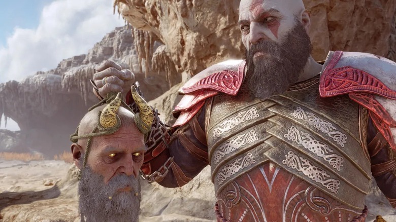 Kratos holding Mimir's head