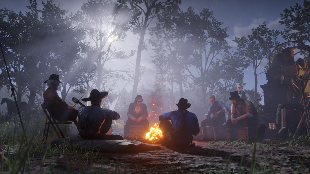 The Van der Linde gang relaxes by the campfire
