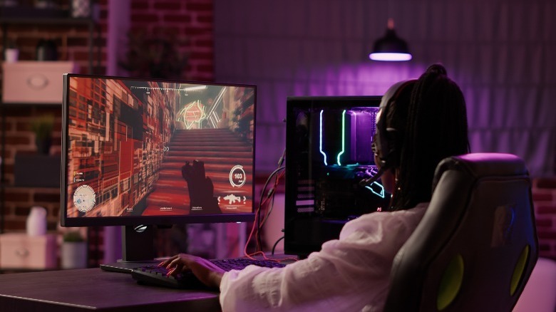Person playing game on computer