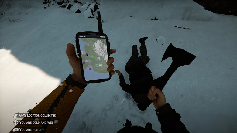 Player standing in snow with GPS