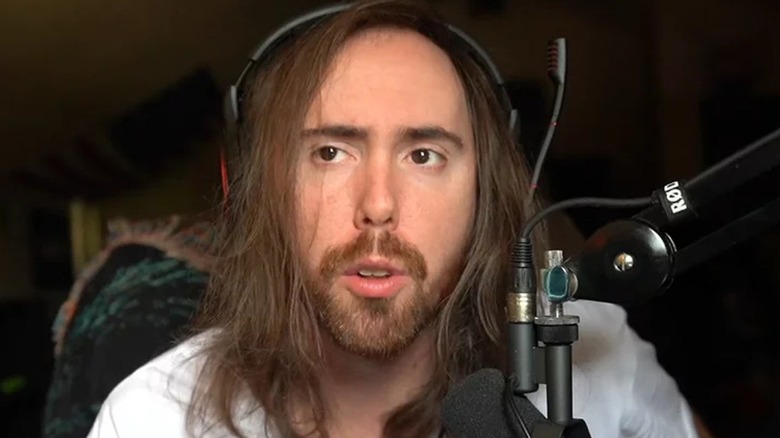 Asmongold sitting in bedroom