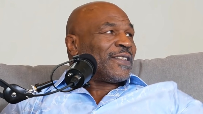 Mike Tyson sitting in front of microphone