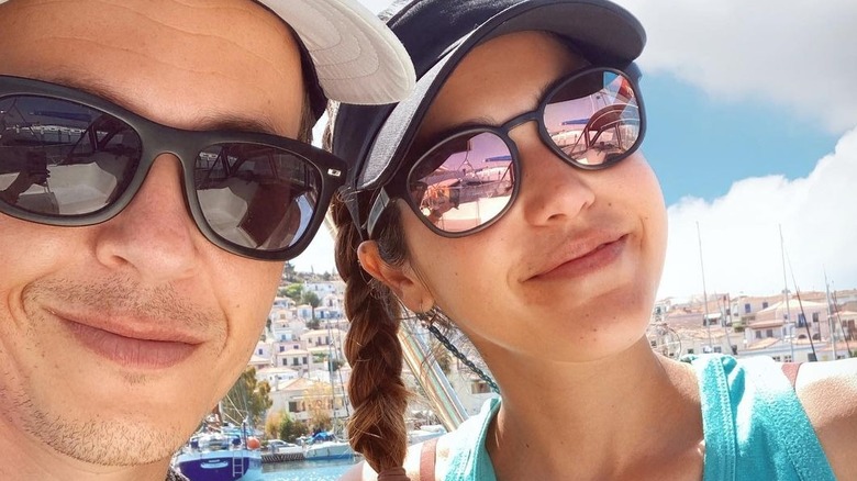 Tallulah and Gaspard taking selfie on boat
